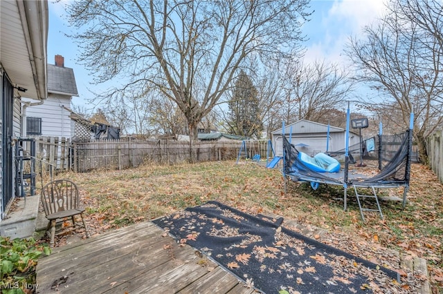 wooden deck with a trampoline