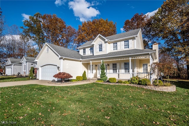 view of front of home with a front yard, a porch, and a garage