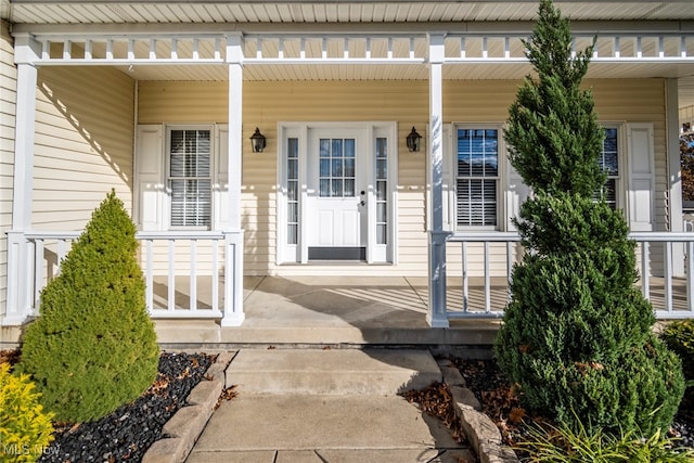 entrance to property with a porch