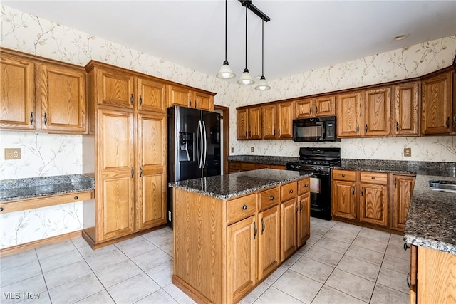 kitchen featuring black appliances, a kitchen island, light tile patterned floors, and hanging light fixtures