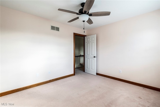 carpeted empty room with ceiling fan