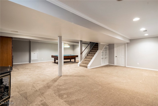 basement with carpet floors, ornamental molding, and billiards