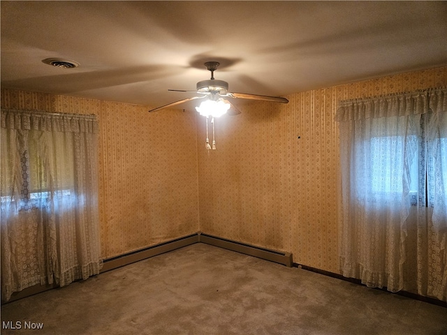 empty room featuring carpet and ceiling fan