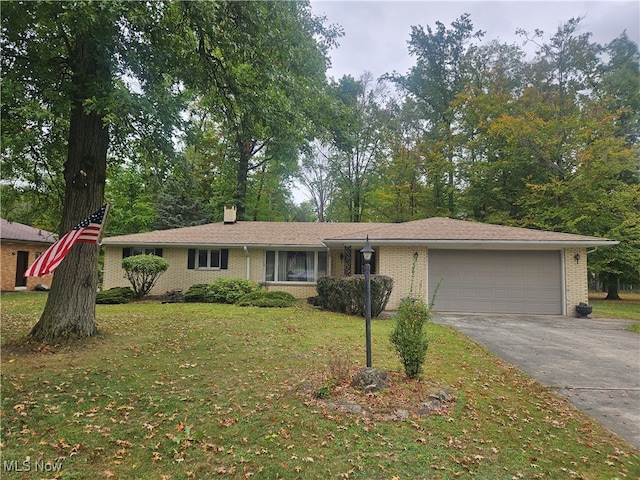 single story home with a garage and a front yard