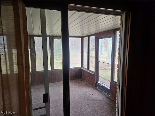 unfurnished sunroom featuring a wealth of natural light