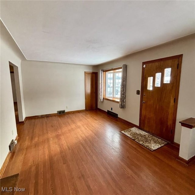 entryway with hardwood / wood-style floors