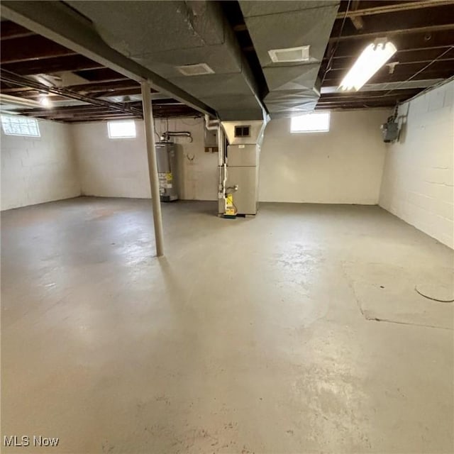 basement with heating unit and water heater