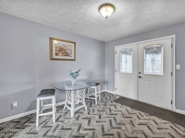 entrance foyer with a textured ceiling