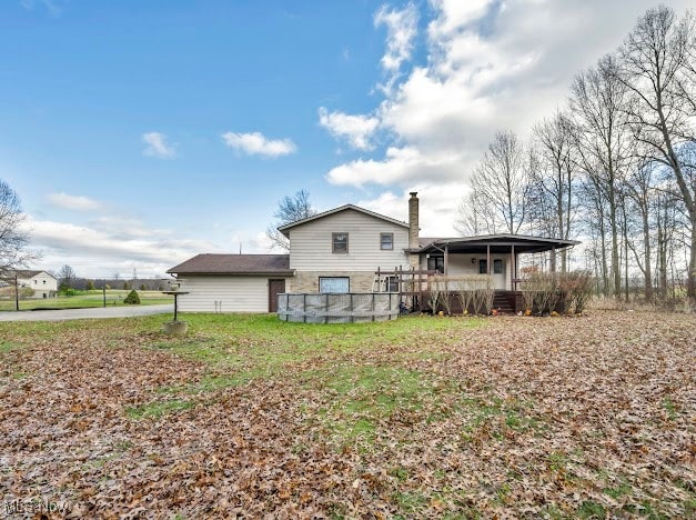 back of house with covered porch