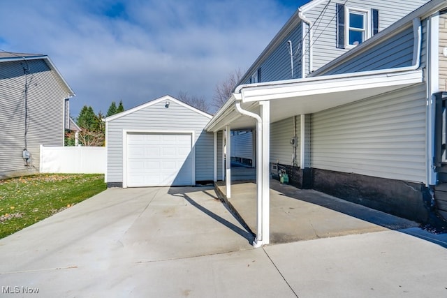 view of front of house featuring a garage and an outdoor structure