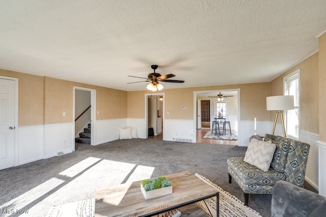 living room with carpet floors and a textured ceiling