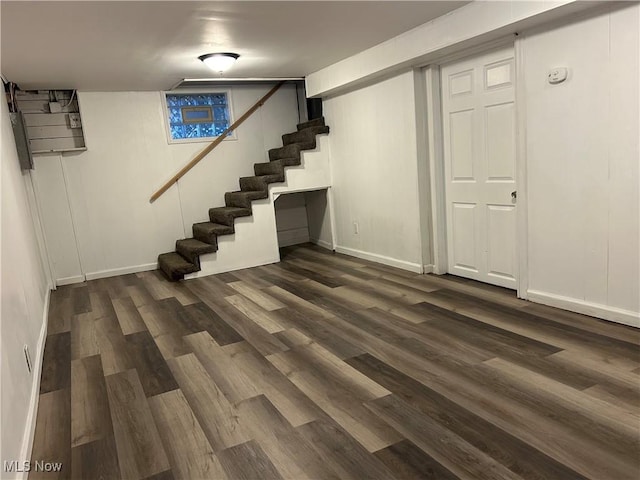 basement with dark wood-type flooring