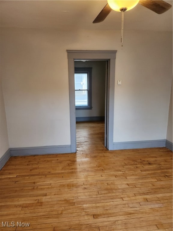 unfurnished room featuring ceiling fan and light hardwood / wood-style flooring