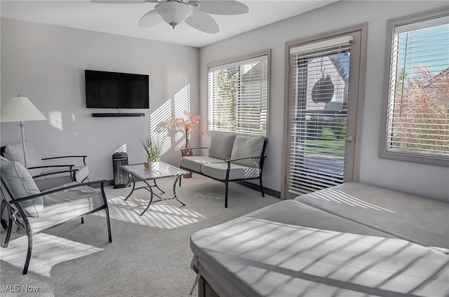 bedroom featuring ceiling fan and light carpet