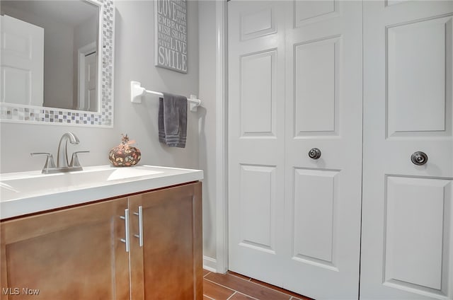 bathroom with vanity and wood-type flooring