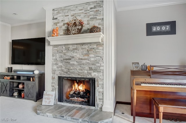 miscellaneous room featuring carpet floors, a stone fireplace, and crown molding