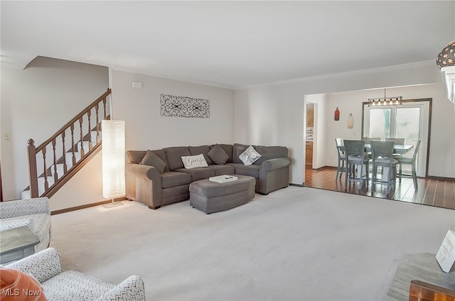 living room featuring light hardwood / wood-style flooring and ornamental molding