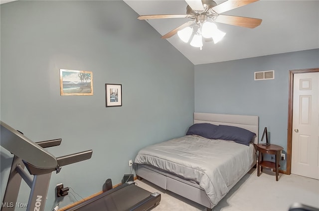 bedroom with ceiling fan, light carpet, and vaulted ceiling