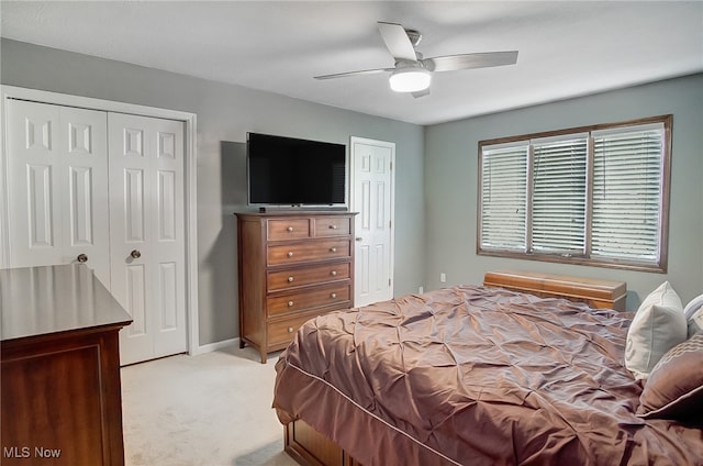 bedroom with light carpet and ceiling fan