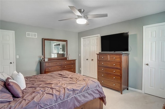 carpeted bedroom with ceiling fan