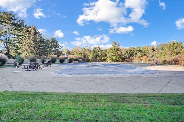 view of swimming pool with a patio area