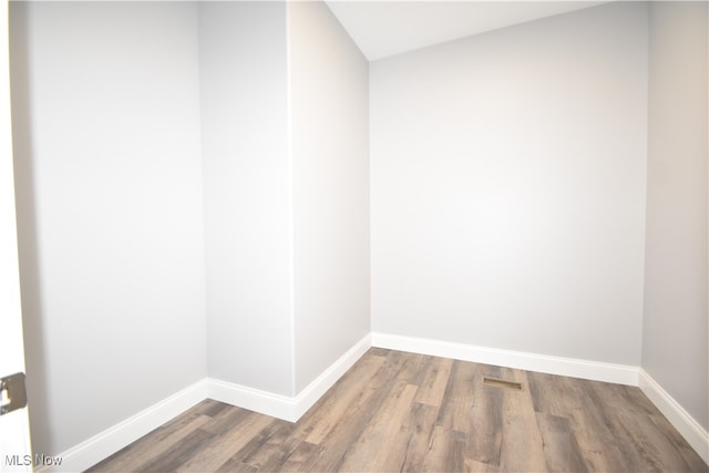 spare room featuring hardwood / wood-style floors