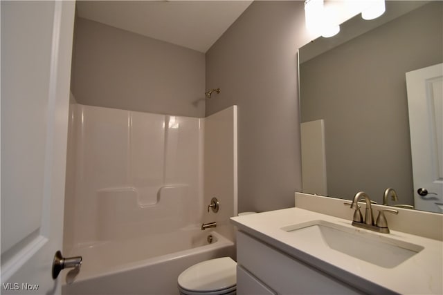 full bathroom featuring vanity,  shower combination, and toilet