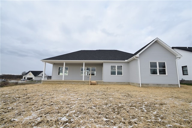 back of house featuring covered porch