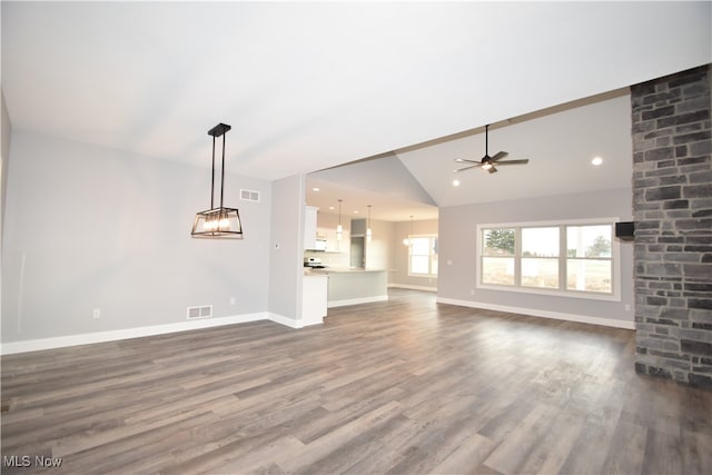 unfurnished living room with ceiling fan, dark hardwood / wood-style flooring, and lofted ceiling