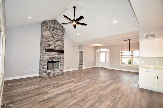 unfurnished living room with a fireplace, hardwood / wood-style floors, and ceiling fan