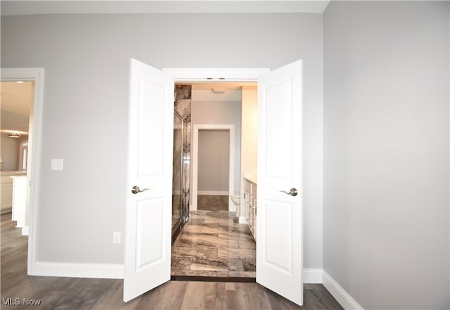 corridor with dark wood-type flooring