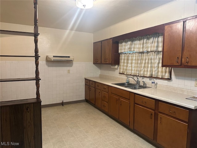 kitchen featuring tile walls, sink, a wall mounted air conditioner, and dark brown cabinets