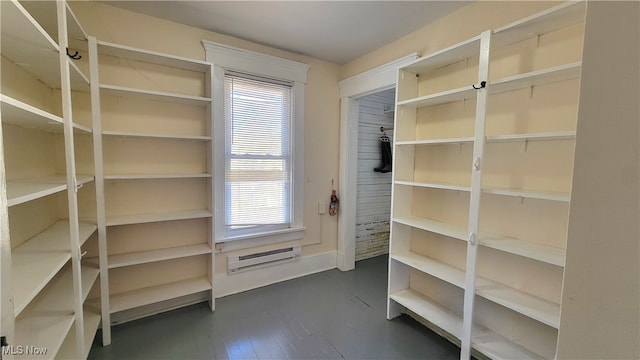 storage room with a wall mounted air conditioner