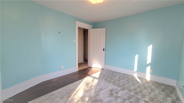 spare room featuring hardwood / wood-style flooring