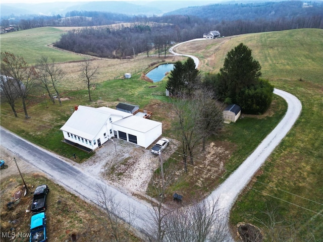 birds eye view of property with a rural view