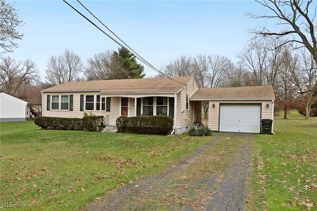 ranch-style home with a front lawn and a garage