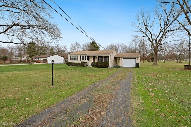 ranch-style home with a front yard and a garage