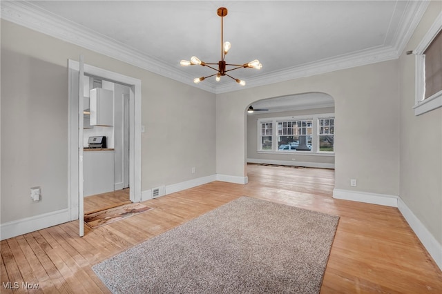 unfurnished dining area with light hardwood / wood-style floors, a notable chandelier, and ornamental molding