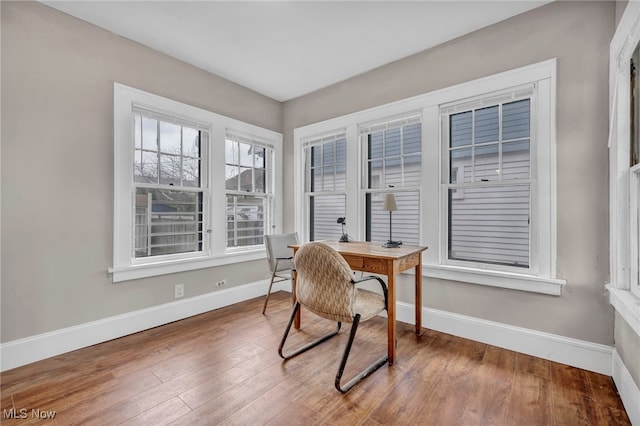 home office with hardwood / wood-style floors