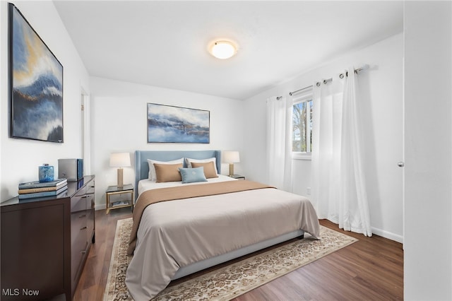 bedroom featuring dark hardwood / wood-style floors