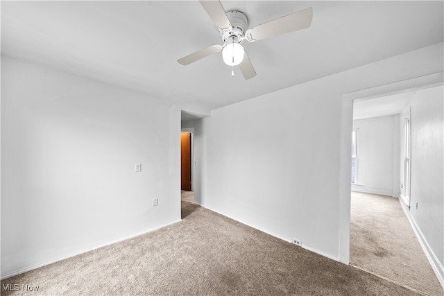 empty room with carpet floors and ceiling fan