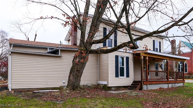 back of house featuring covered porch