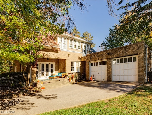 view of front of house featuring a garage and french doors