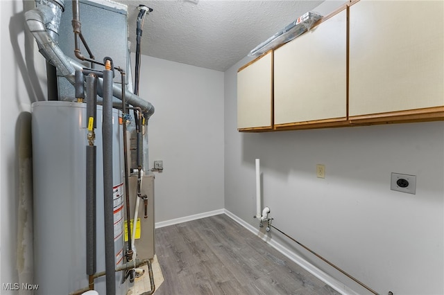 utility room featuring water heater