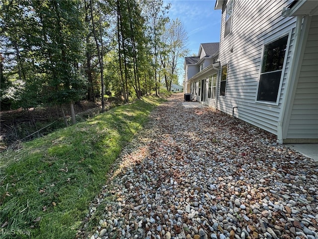 view of yard with central air condition unit