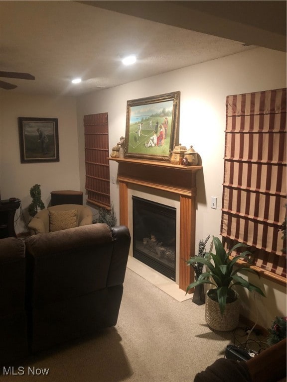 living room featuring ceiling fan and light carpet