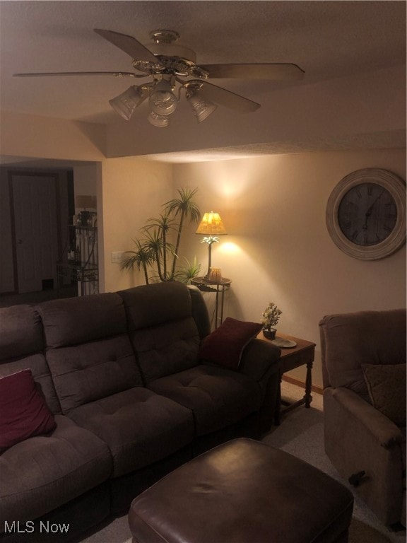 living room with carpet and ceiling fan