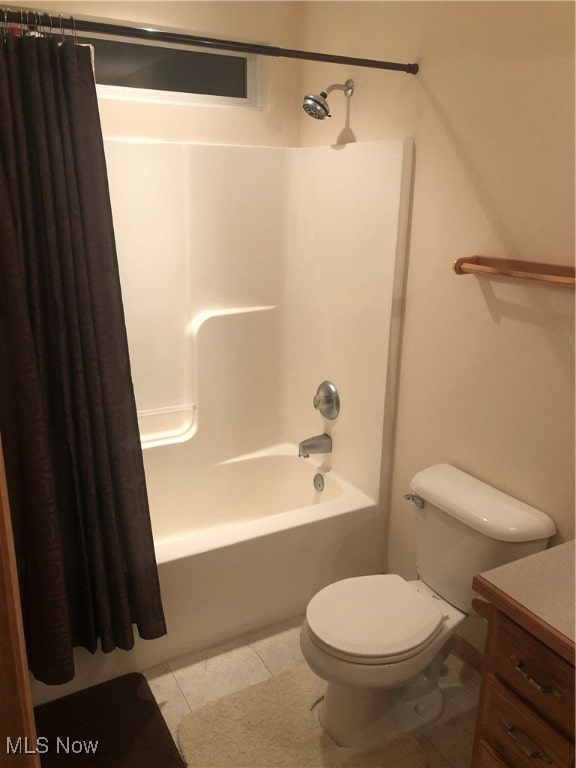 full bathroom with tile patterned floors, vanity, toilet, and shower / tub combo