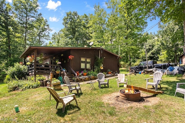 view of yard with a fire pit