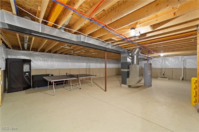 basement with heating unit and electric water heater